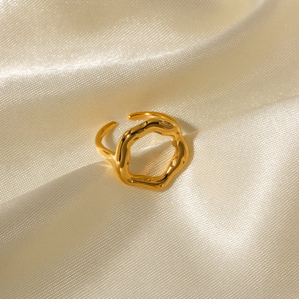 Gold ring with an organic irregular circle shape made of surgical steel