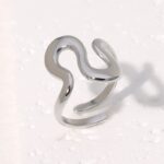 Modern silver ring with an irregular wavy shape