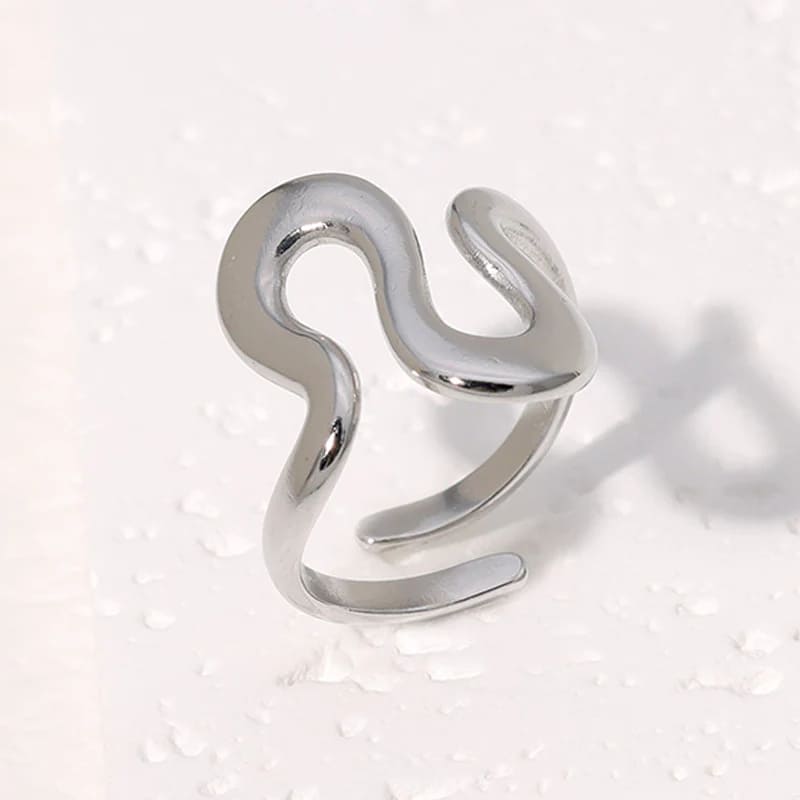 Modern silver ring with an irregular wavy shape