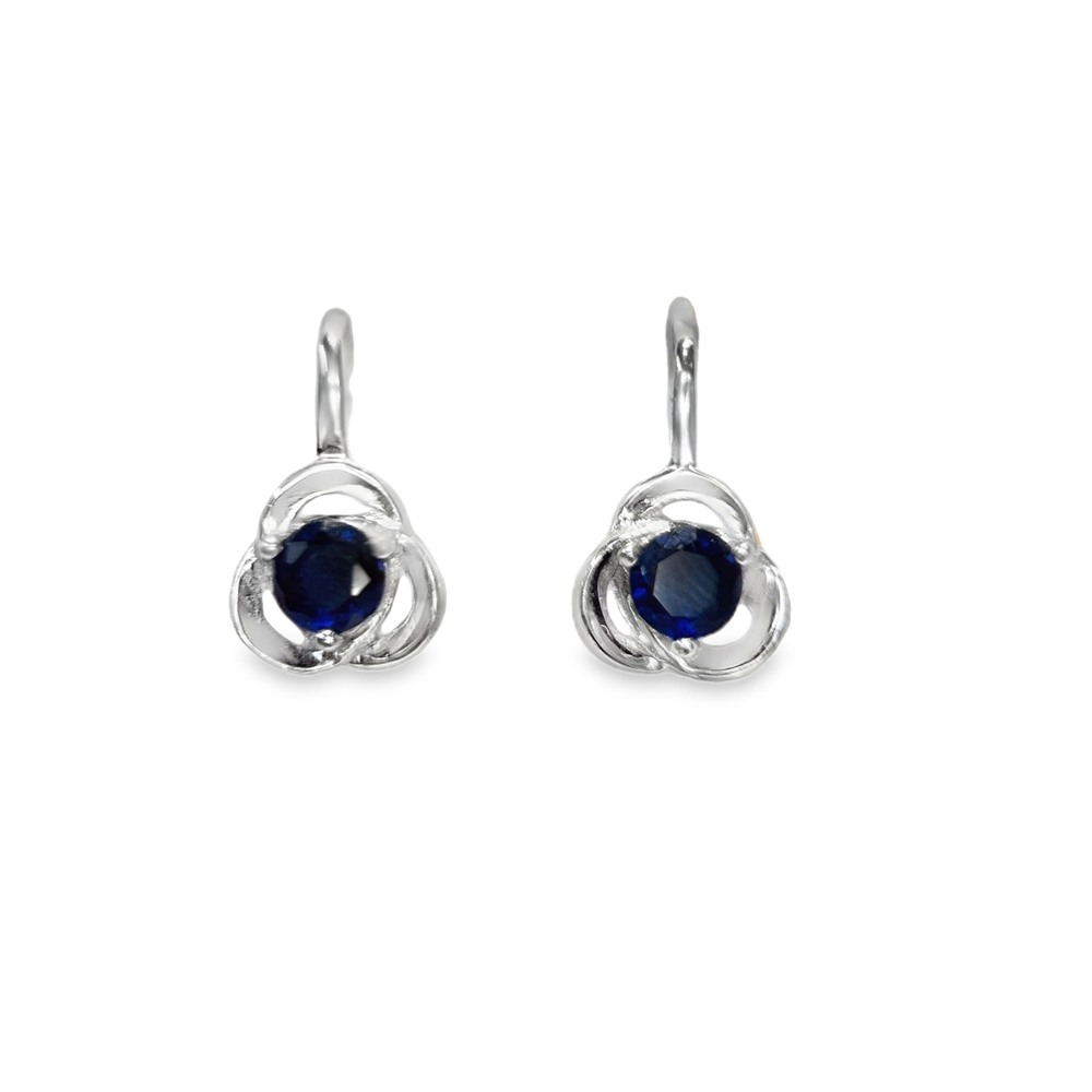 Silver earrings with a blue zircon in an ornate intertwined Blue Style frame.